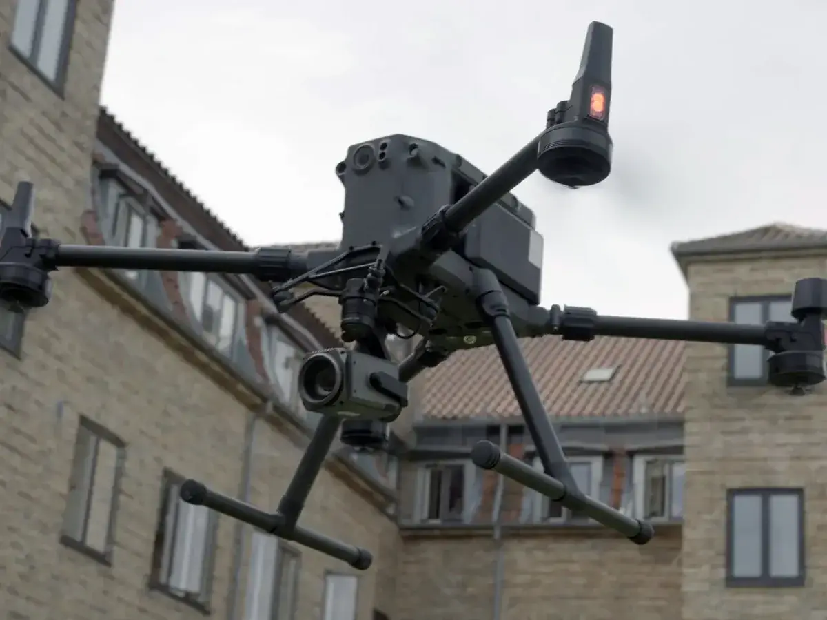 Drone flying in front of a Danish apartment building